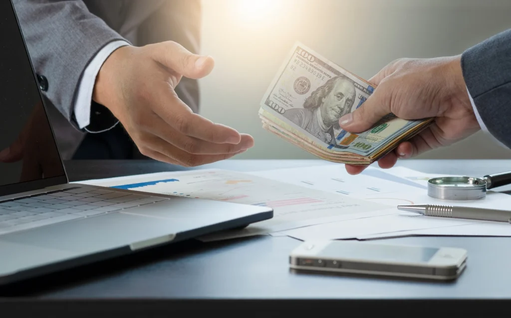 Men exchanging money.