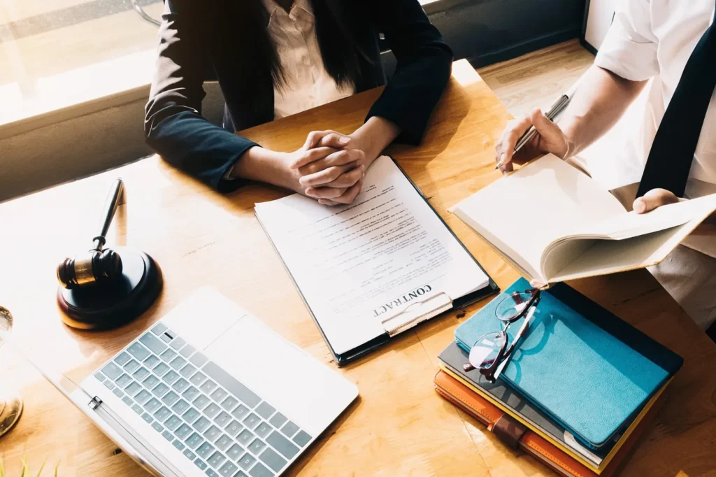 An attorney speaking with a client about a contract.
