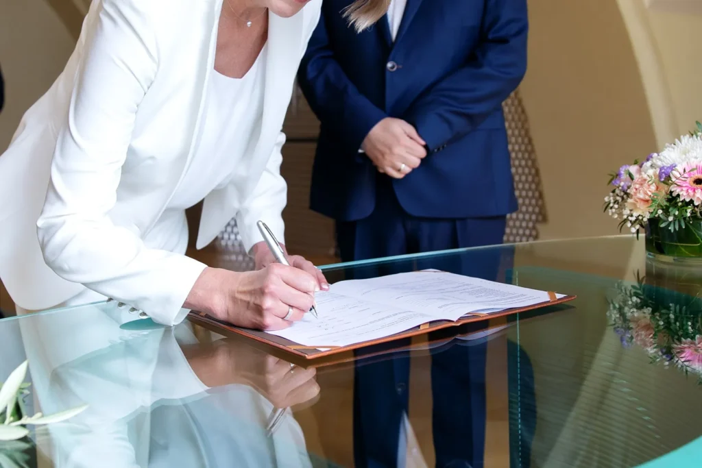 A couple signing their divorce papers.