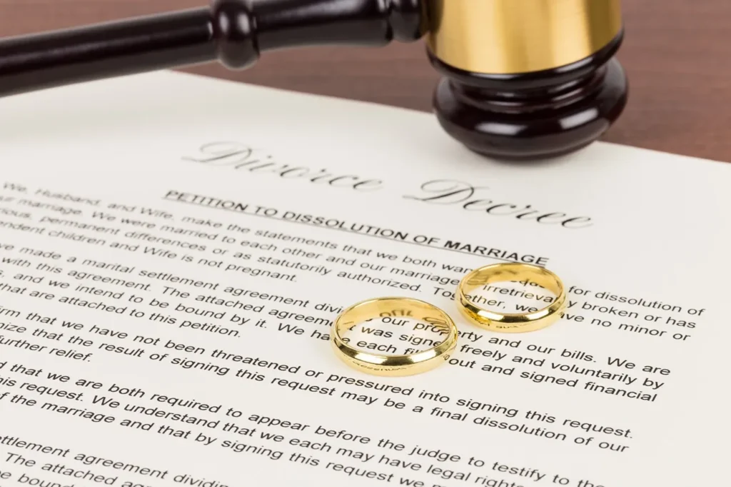 Two gold rings sitting on top of a divorce decree.