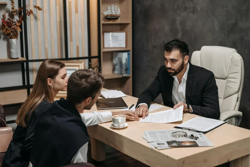 A couple meeting with a family law attorney.